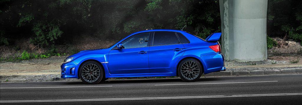 Blue Subaru WRX STI side profile supported with HP Tuners software